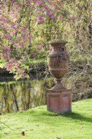 Decorative terracotta urn beside the canal in John Massey's garden in October.