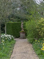 East Ruston Old Vicarage Gardens, Norfolk,  Spring. Statue in woodland area
