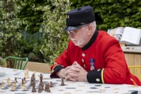 Chelsea pensioner playing chess on the London Square Community Garden,Gold winner, Designer: James Smith