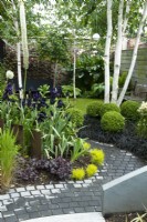 Path of black setts leading to rear town garden designed in modern style of themed colours and architectural shapes - Hidden Gardens Day, Woodbridge, Suffolk 