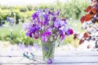 Bouquet of flowers containing Lathyrus 'Midnight Blues', Gypsophila elegans 'Covent Garden', Agrostemma githago - Corn cockle, Salvia viridis 'Blue Monday' and Briza maxima