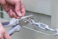 Woman crimping ferrule onto the wire