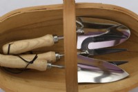 Gardening hand tools in wooden trug  May