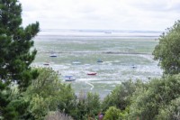 View of the seafront with low tide and boats scattered upon the shore