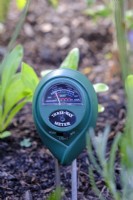 Soil meter that measures measuring moisture, pH and light.