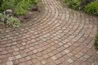 Curved paving with brick setts at Barnsdale Gardens, April
