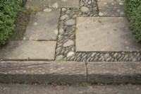 Paving in the Reclaimed Garden, edged with railway sleepers covered in chicken wire to make them less slippery. Barnsdale Gardens, April