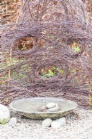 Bird bath with woven birch protective fence
