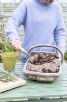 Woman mixing grit and compost