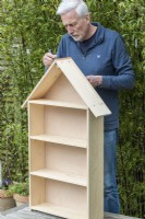 Step-by-Step Making a Plant Theatre. Step 19: Anthony Wagstaff gives the unit three coats of wood preservative, paying particular attention to any sawn edges, especially on the plywood.