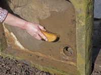 Planting up an stone alpine sink sequence - Step # 1 - Turn the sink onto its end and clean with a scrubbing brush