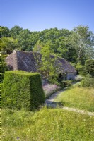 Looking over the topiary meadow towards the hovel in mid summer