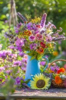 Colorful bouquet of summer flowers iincluding  Zinnia elegans, Echinacea purpurea, Monarda, Cleome spinosa, Verbena bonariensis, Foeniculum vulgare, Nepeta kubanica, Lavatera trimestris, Teucrium hircanicum and Liatris spicata.