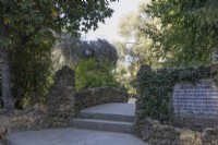 Steps lead up to a stone bridge. Parque de Maria Luisa, Seville, Spain. September