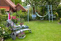 Family garden with seating area and swing 