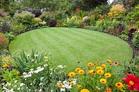 Circular lawn lined with flowerbeds 