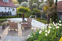 Seating area with Tulipa Maja, Tulipa Verona, Tulipa Francoise, Tulipa Ivory Floradale, Fritillaria persica Ivory Bells 