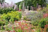 Rock garden with larkspur, catnip, clary sage, Centranthus ruber, Nepeta, Salvia sclarea 