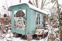 Garden house in the snow 