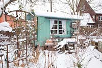 Garden house in the snow 