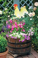 Wooden barrel with balcony plants 