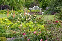 Bed with roses and perennials 