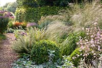 Front garden with grasses and ground cover 