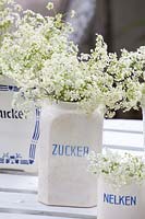 Antique storage jars with cow parsley 