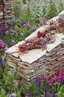 Natural garden with stone wall 