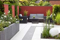 Modern garden with seating area and wall panels 