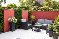 Modern garden with seating area and wall panels 