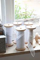 Thread spools with lace ribbons 