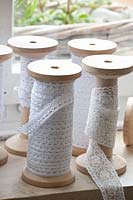 Thread spools with lace ribbons 