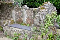 Ruined bench in the garden 