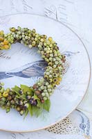 Wreath of rose hips, pepper berries and myrtle leaves, Myrtus communis, Piper nigrum 