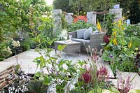 Seating terrace, Astilbe, Hosta, Ligularia, Primula vialii 