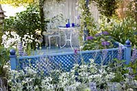 Bed in front of seating area, Lupinus The Governor, Eryngium giganteum, Eryngium giganteum Miss Willmotts Ghost, Hydrangea macrophylla, Campanula persicifolia La Bonne Amie, Echinops ritro Veitchs Blue, Perovskia atriplicifolia Blue Spire 