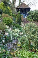 Garden with pavilion, Arabis suendermanii, Chionodoxa forbesii, Scilla siberica, Rhododendron 