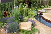 Gravel garden with water basin, Hosta sieboldiana Elegans, Panicum virgatum Northwind, Hakonechloa macra, Rosmarinus officinalis Capri, Lavandula Hidcote, Hydrangea arborescens Annabelle, Digitalis ferruginea 