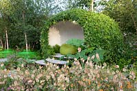 Modern garden with green arbor, Verbascum, Geum Totally Tangerine, Astrantia major Star of Beauty 