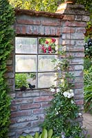 Rustic brick wall with old window 