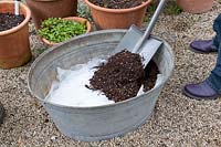 Sow flower meadow in a metal tray, add potting soil on drainage layer and fleece into the tray 