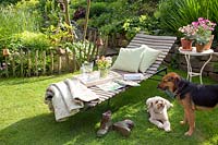 Lounger in the garden with dogs 