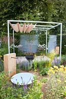 Small gravel garden with pergola, Achillea Terracotta, Perovskia Lacey Blue, Deschampsia cespitosa Goldtau, Verbascum Clementine, Leucanthemum superbum Snowcap 