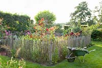 Rural garden with wheelbarrow 