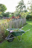 Rural garden with wheelbarrow 