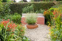 Mediterranean garden with tiled bench 