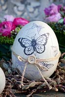 Easter egg in vintage style with butterfly motifs 