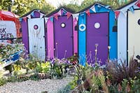 Bathing hut with green roof in the beach garden 