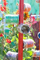 Bird feeding station made from tin cans 